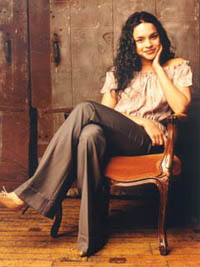 Norah Jones sitting in a chair